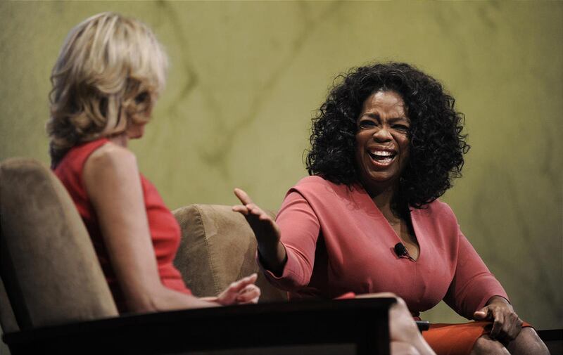 Oprah Winfrey, right, talks with Paula Zahn on Thursday at the Chicago trade show.
