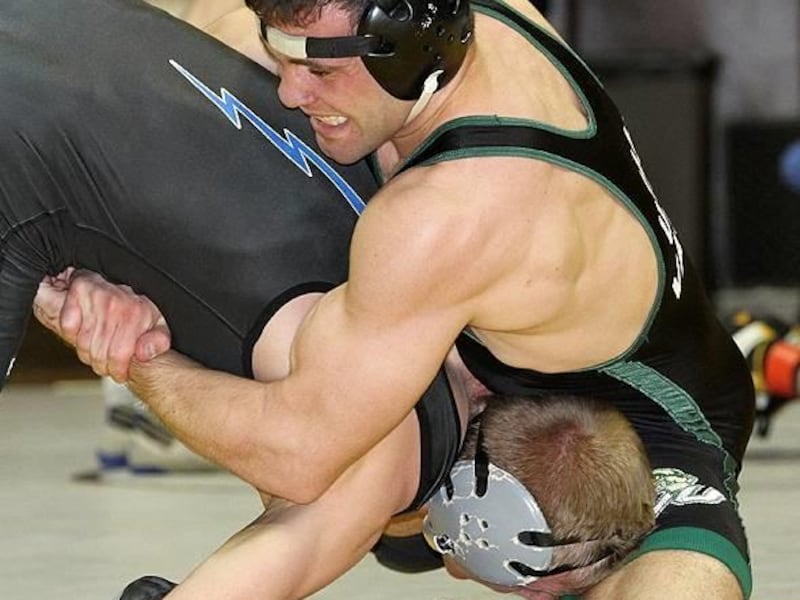 UVU senior 149-pounder Josh Wilson gets his opponent in a tight hold. Wilson defeated Air Force senior Cole VonOhlen in the title bout Saturday at the Arena-Auditorium in Laramie, Wyo.