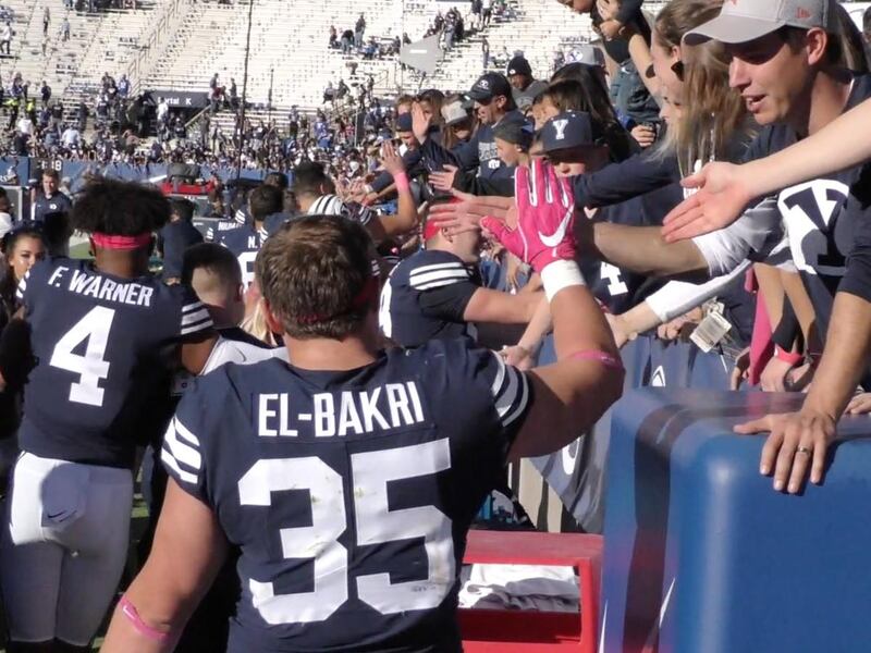 BYU players, including fullback Brayden El-Bakri and linebacker Fred Warner high-five fans following the Cougars' 41-20 win over San Jose State on Saturday, Oct. 28, 2017, at LaVell Edwards Stadium in Provo.