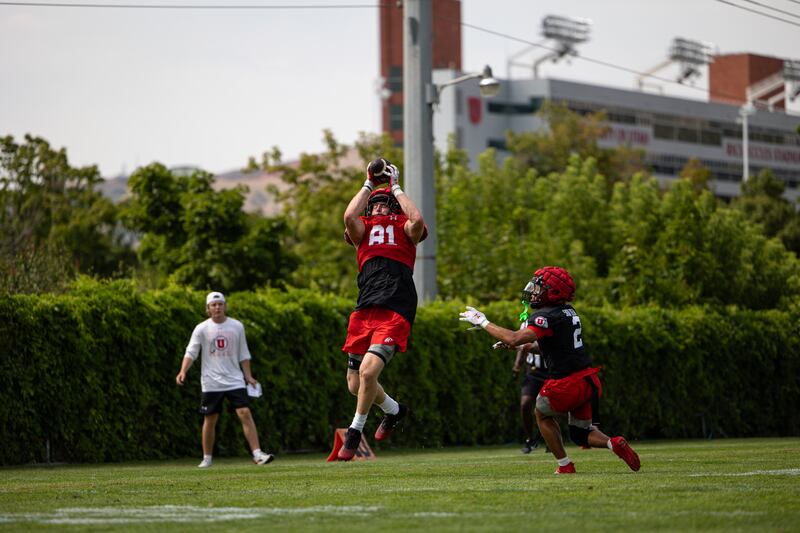 Utah tight end Caleb Lohner makes a catch during fall drills at the University of Utah in Salt Lake City. The former college basketball player will be strapping on a helmet for the Utes this fall.