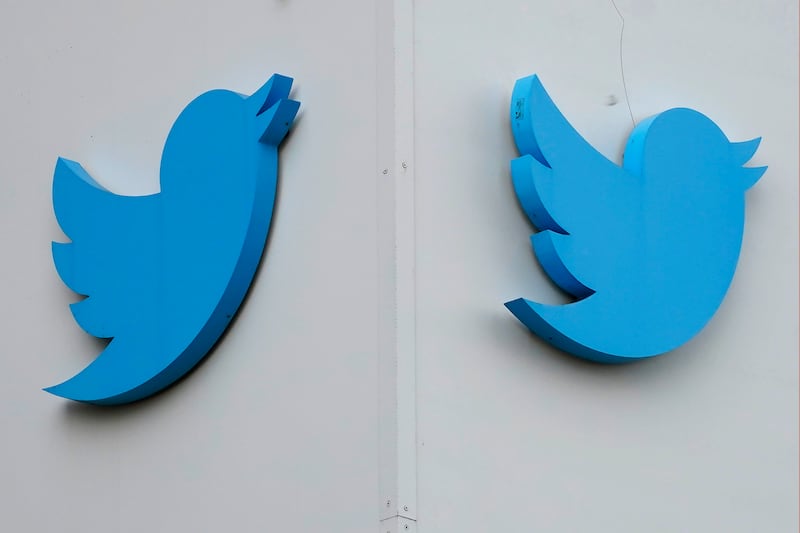 Twitter logos are displayed outside the company’s offices in San Francisco on Dec. 19, 2022.