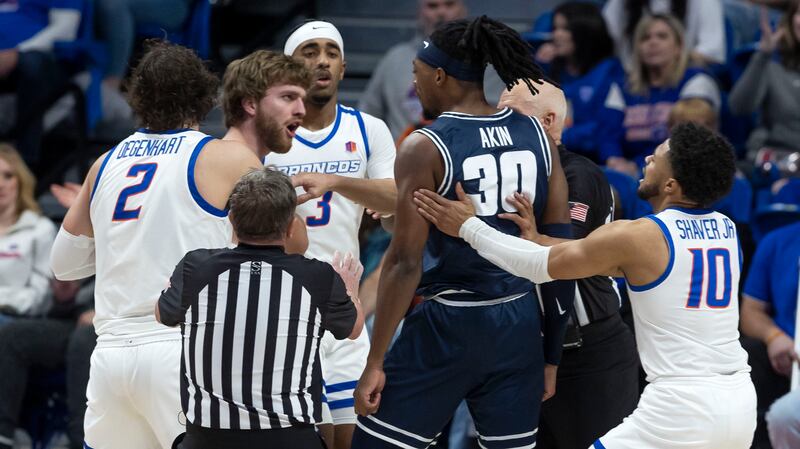 Boise State guard Max Rice and Utah State forward Dan Akin exchange words late in the game, Jan. 7, 2023, in Boise, Idaho.
