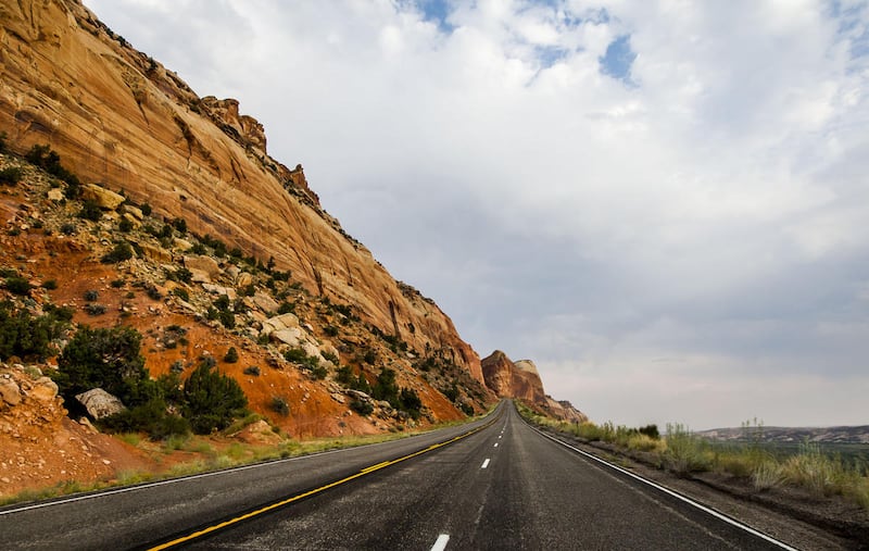 Walls of red rock line the road to Blanding, San Juan County, on Thursday, Aug. 20, 2015.