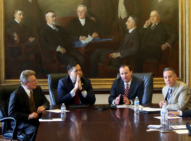 Spencer Austin, chief criminal deputy for the Utah Attorney General's Office, left, Utah Attorney General Sean Reyes, Sen. Mike Lee and Brian Besser, Drug Enforcement Administration special agent in charge in Salt Lake City, talk to members of the media a