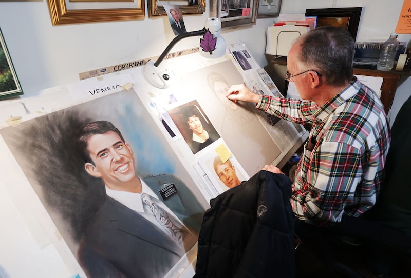 Vietnam veteran JR Johansen creates a portrait for the family of a deceased Latter-day Saint missionary at his home.