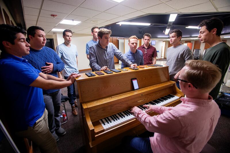 McKay Crockett, producer and artistic director for BYU's Vocal Point works with the group during rehearsal at the Harris Fine Arts Center in Provo on Friday, Jan. 18, 2019.