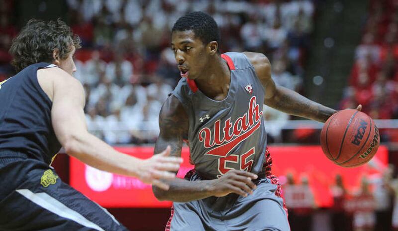Utah Utes guard Delon Wright (55) sizes up Wichita State Shockers guard Evan Wessel (3) as Utah and Wichita State play Wednesday, Dec. 3, 2014, in the Huntsman Center at the University of Utah in Salt Lake City.
