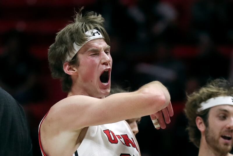 Utah Utes center Branden Carlson yells
