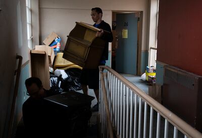 Movers with the Other Side Academy help tenants move out of the Georgia Apartments in Salt Lake City on Thursday, Feb. 14, 2019. The Other Side is moving tenants out free of charge.