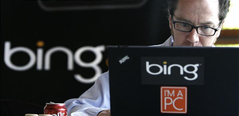 Patrick Porter works on a laptop marked with the logo for Bing, Microsoft's recently upgraded search engine, at Microsoft in Redmond, Wash.
