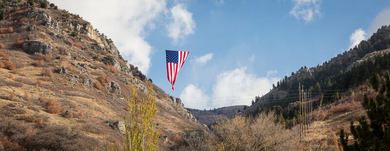 What's being billed as the world’s largest free-flying flag hangs in Cold Water Canyon in North Ogden on Sunday, Nov. 11, 2018. The huge flag was displayed by a local group called Follow the Flag in honor of North Ogden Mayor Brent Taylor who was killed e