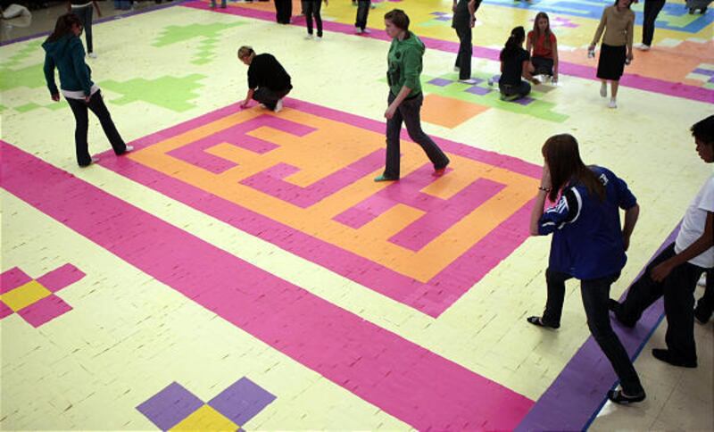 Students at Eisenhower Junior High School in Taylorsville put the finishing touches on a giant mosaic made with Post-It Notes on Friday in an attempt to set a world record. The school prides itself on setting records, boasting it has more than any other s
