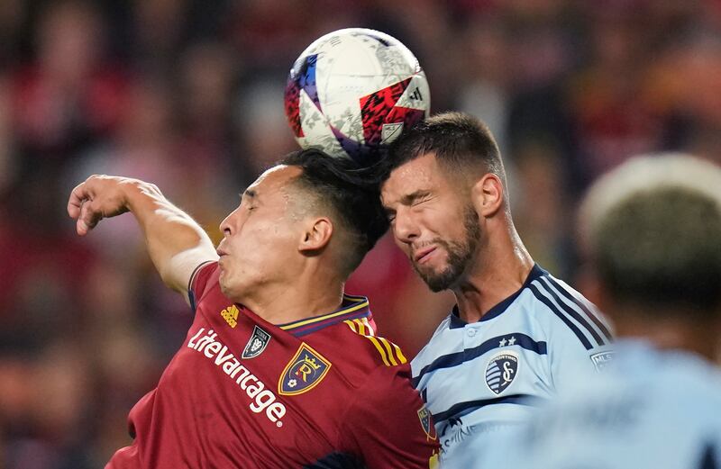 Real Salt Lake forward Rubio Rubin, left, and Sporting Kansas City defender Robert Voloder vie for a head ball Saturday, Oct. 7, 2023.