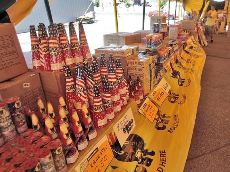 Jeff Pullan arranges inventory during a slow time at a fireworks stand in Provo in July.