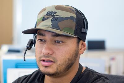 Stephen Leo wears a Nike hat while working at CHG Healthcare Services' headquarters in Midvale on Wednesday, Aug. 8, 2018. Workers are wearing more casual attire as dress codes loosen, according to the Employers Council’s Miscellaneous Benefits & Pay Prac