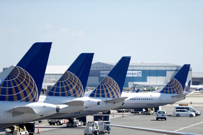FILE - In this July 18, 2018, file photo, United Airlines commercial jets sit at a gate at Terminal C of Newark Liberty International Airport in Newark, N.J. United Airlines is canceling another month’s worth of flights with Boeing 737 Max planes that wer