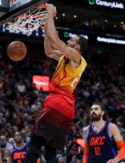 Utah Jazz center Rudy Gobert (27) dunks during the game against the Oklahoma City Thunder at Vivint Smart Home Arena in Salt Lake City on Saturday, Dec. 22, 2018.