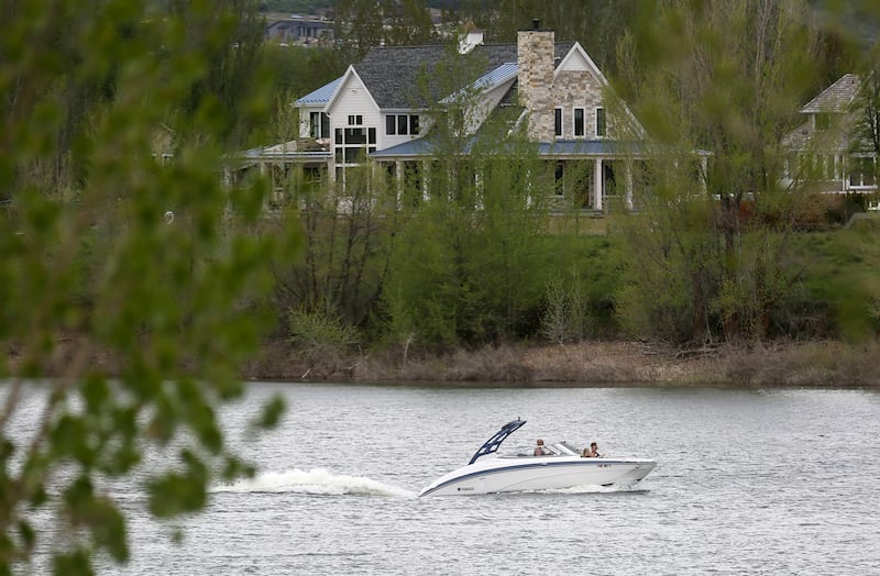 Boaters pilot a boat on Pineview Reservoir near Huntsville, Weber County, on Wednesday, May 15, 2019.