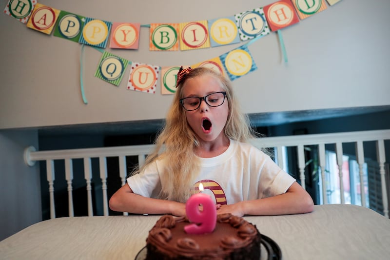 Quinn Sellers prepares to blow out the candle on her birthday cake on her ninth birthday, Tuesday, May 14, 2019, at her home in Taylorsville, Utah. Quinn was a so-called "micropreemie" when she was born at just 25 weeks.