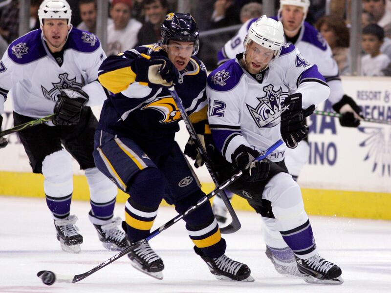 Buffalo Sabres and Los Angeles Kings players battle for the puck during an NHL hockey game, Dec. 6, 2007, in Los Angeles.