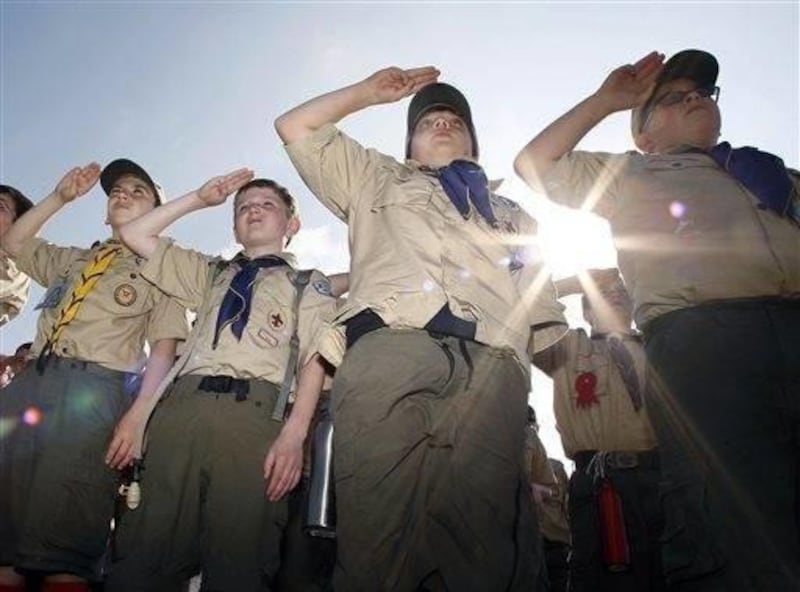 Boy Scouts salute early Saturday morning, May 21, 2011 during New Jersey\'s Boy Scouts Camporee in Sea Girt, N.J.