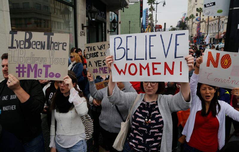 Participants march against sexual assault and harassment at the #MeToo March in the Hollywood section of Los Angeles on Sunday, Nov. 12, 2017. (AP Photo/Damian Dovarganes)