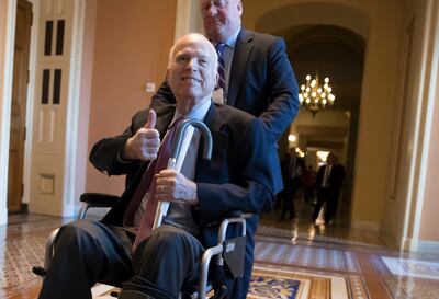 FILE - In this Dec. 1, 2017 file photo, Sen. John McCain, R-Ariz., leaves a closed-door session on Capitol Hill in Washington.