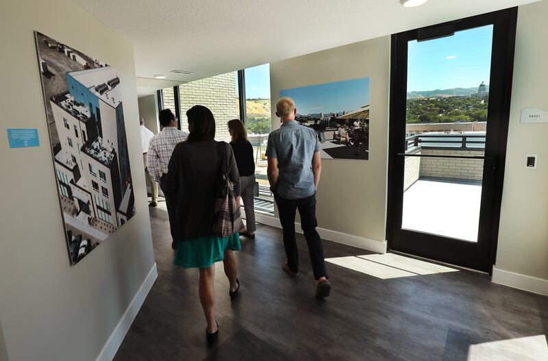 Tours are given during an opening event for a net-zero emissions apartment building called Project Open in Salt Lake City on Tuesday, June 12, 2018. Its developers say it's the tallest net-zero apartment building in Utah and the first to be built for the