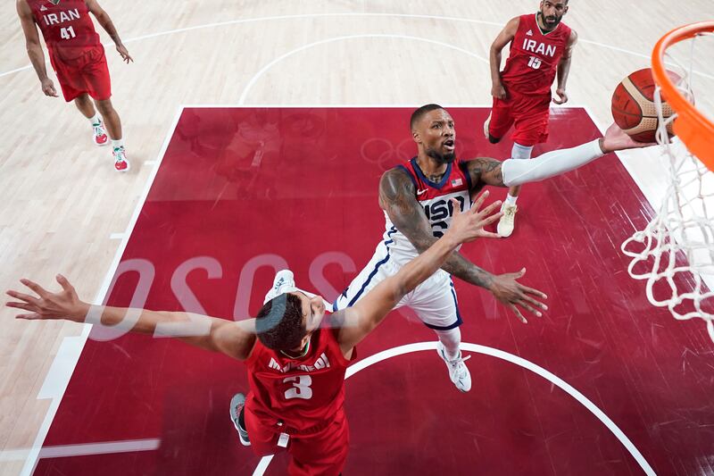 United States’ Damian Lillard shoots over Iran’s Mohammadsina Vahedi.
