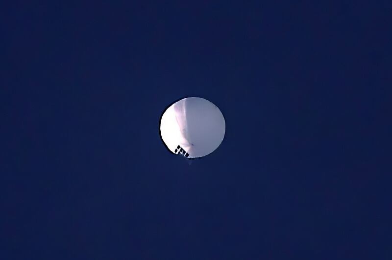 A high altitude balloon floats over Billings, Mont., on Wednesday, Feb. 1, 2023. The huge, high-altitude Chinese balloon drew Pentagon accusations of spying and sending excited or alarmed Americans outside with binoculars.