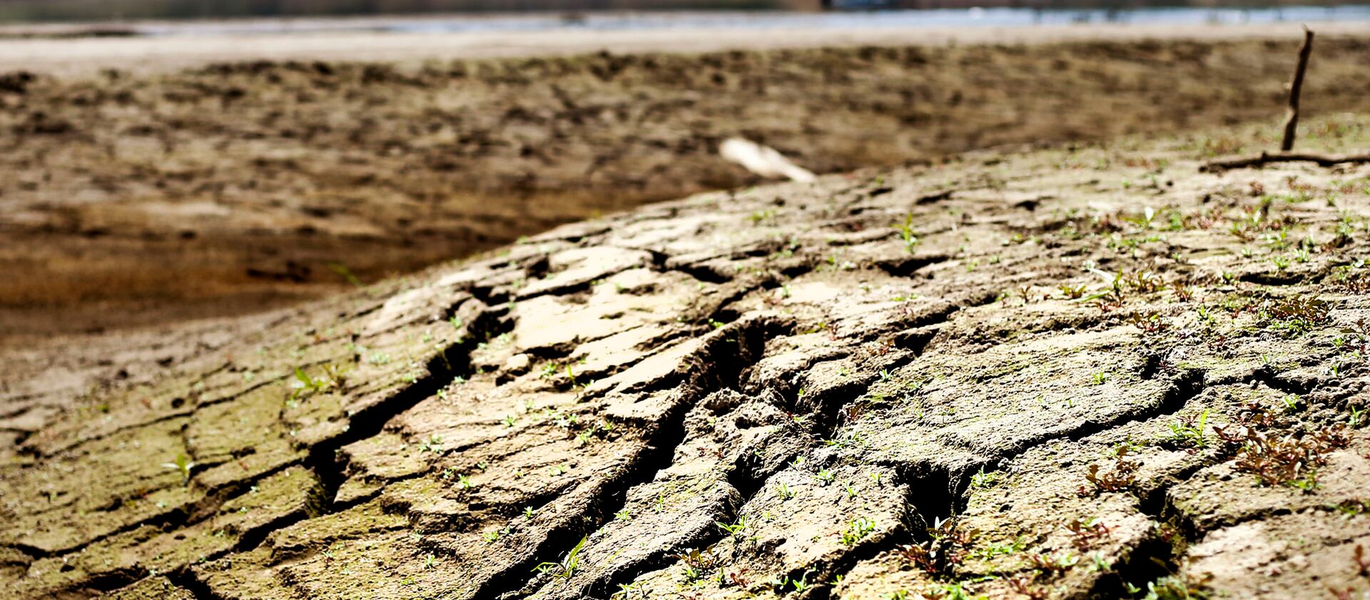 Cracked earth is seen in the waterbed of Jordanelle Reservoir near Kamas,