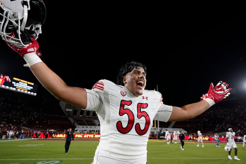 Utah offensive lineman Spencer Fano celebrates after the team's win against Southern California, Saturday, Oct. 21, 2023, in Los Angeles.
