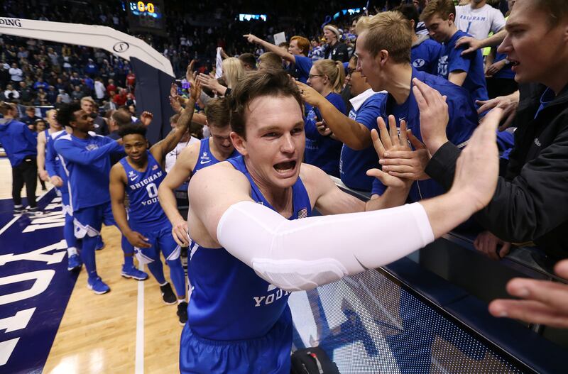 Brigham Young Cougars forward Payton Dastrup (15) celebrates the win over Utah in Provo on Saturday, Dec. 16, 2017. BYU won 77-65.