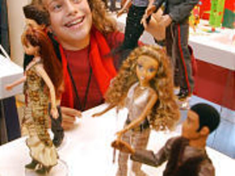 Hannah Silver, 12, of North Bellmore, N.Y., looks at My Scene figures by Mattel at a New York toy show. My Scene Barbie is edgier than the regular Barbie.
