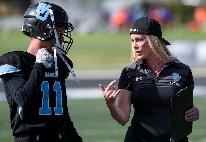 West Jordan assistant football coach Stephanie Davis watches her defensive unit play during the West Jordan-Riverton sophomore game at West Jordan High on Wednesday, Sept. 12, 2018. Davis is the only female football coach in the state. She is the defensiv