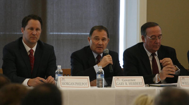 Republican Women of Utah Valley host the 2012 Republican gubernatorial debate in South Jordan on Wednesday, April 11, 2012. Gov. Gary Herbert makes a point as Morgan Philpot, left, and William Skokos, right, listen.