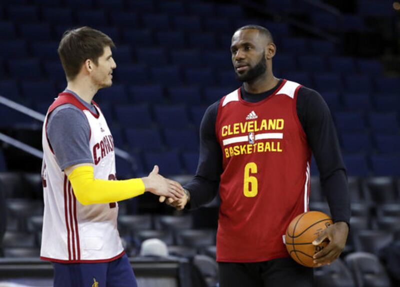 Cleveland Cavaliers' LeBron James, right, shakes hands with teammate Kyle Korver during an NBA basketball practice, Wednesday, May 31, 2017, in Oakland, Calif. The Cavaliers face the Golden State Warriors in Game 1 of the NBA Finals on Thursday in Oakland