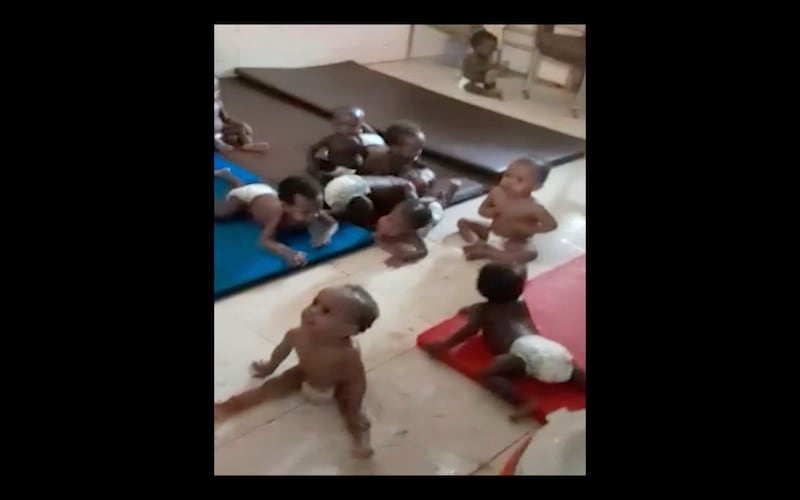 A video still shows toddlers at the Foster Home for Orphans in Khartoum, Sudan.