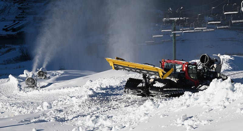 Human-made snow is blown onto the mountain at the Utah Olympic Park in Park City on Nov. 27, 2023.