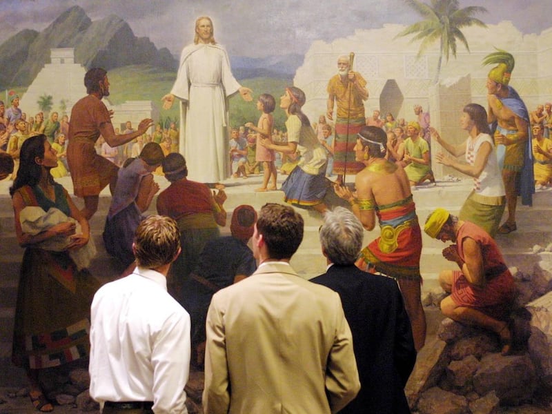 Two people admire the painting "Christ Visits the Americas" by John Scott at Conference Center in March 2001.
