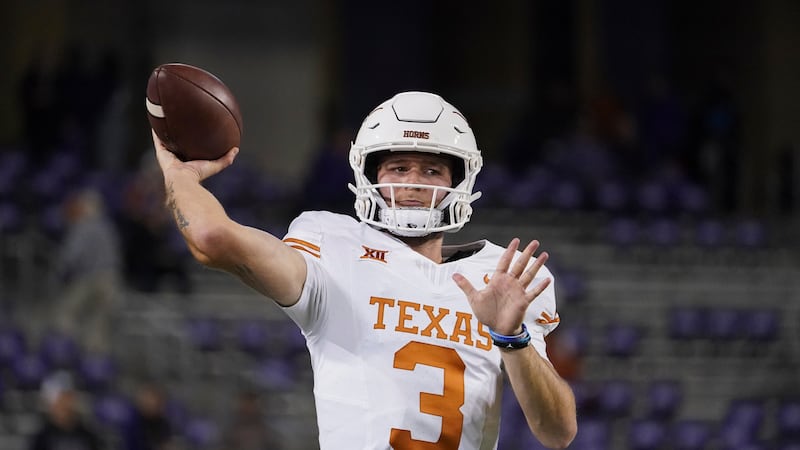 Texas quarterback Quinn Ewers works out prior to an NCAA college football game against TCU, Saturday, Nov. 11, 2023.