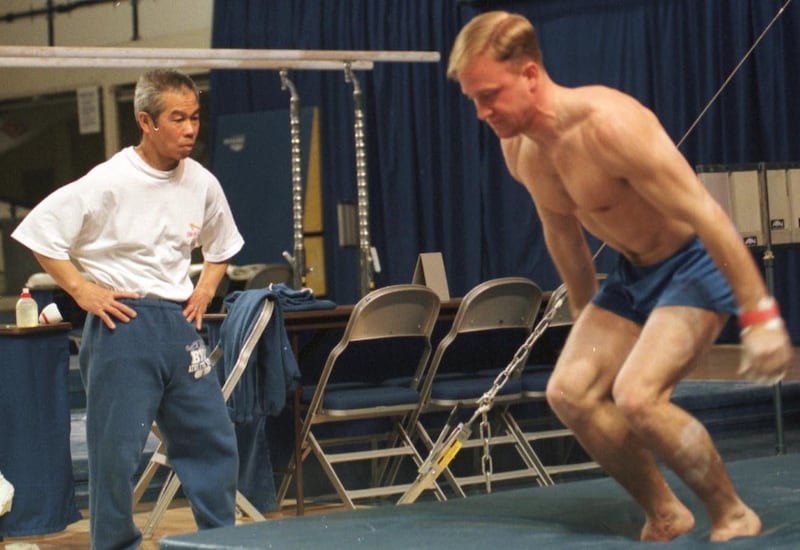 Head Gymnastics coach Mako Sakamoto at a BYU practice