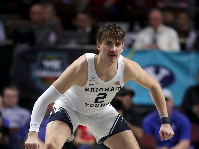 Brigham Young Cougars guard Zac Seljaas, wearing white, gets into his defensive position