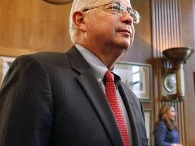 FILE - In this Oct. 13, 2011, file photo, Larry Echo Hawk, Assistant Secretary of Indian Affairs Larry Echo Hawk, left, appears on Capitol Hill in Washington before a Senate Indian Affairs Committee hearing. Echo Hawk is resigning to accept a full-time le
