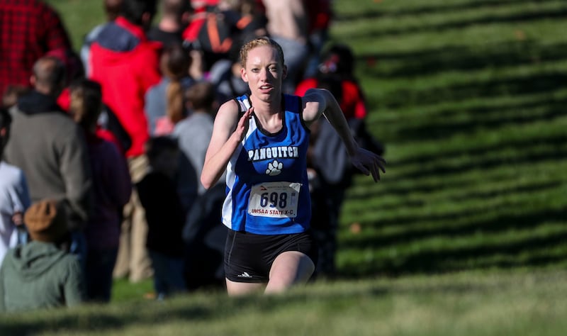 Taylia Norris, of Panguitch, climbs a long hill during the girl's 1A high school cross country try championships at Sugarhouse Park in Salt Lake City on Wednesday, Oct. 17, 2018.