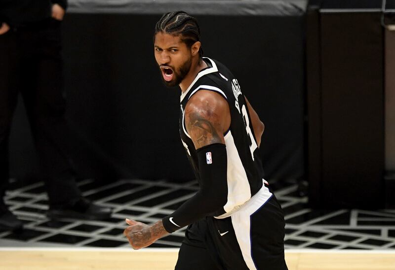 Los Angeles Clippers’ Paul George reacts after shooting a 3-pointer.