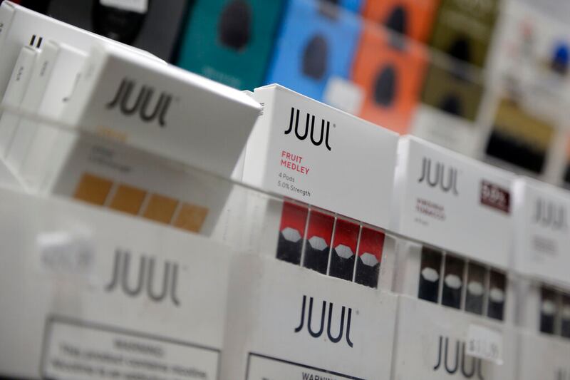 Juul products are displayed at a smoke shop.