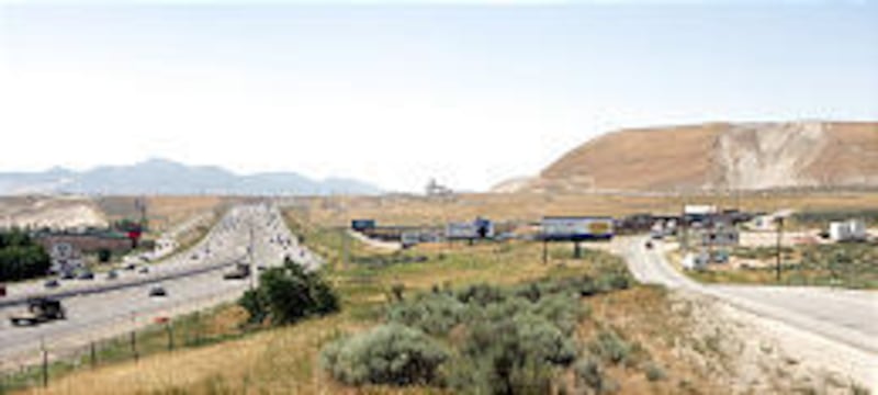 Looking north, traffic on I-15 makes its way past Point of the Mountain. The Point used to nearly touch I-15, but sand and gravel excavation has pushed it farther east.