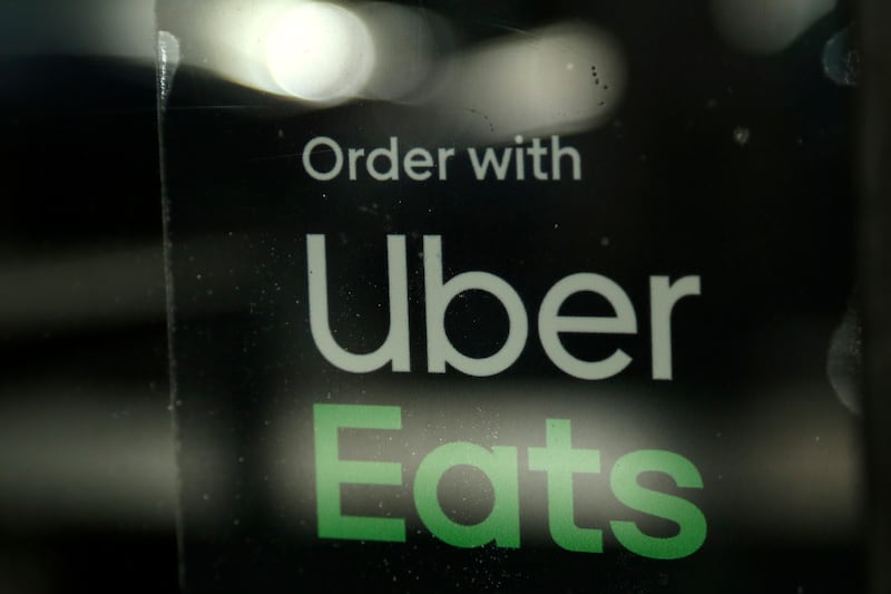 In this Nov. 6, 2019, file photo, a restaurant advertises Uber Eats in Miami.