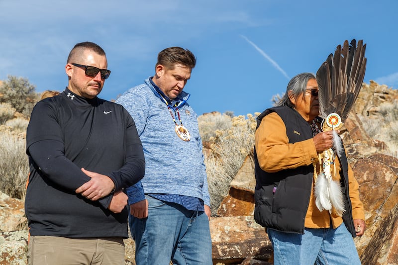 Members of the Northwestern Band of the Shoshone Nation pause for a blessing by Rios Pacheco, a tribal spiritual leader on the right, during the repatriation of a sacred rock with petroglyphs created by their ancestors. The rock was taken around 80 years ago and placed at a Latter-day Saint meetinghouse in Tremonton, Utah. The Church had the stone cleaned and preserved on Thursday, December 11, 2025, near the Utah-Idaho border.